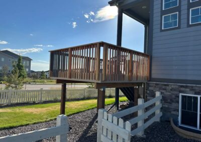 new corner deck on gray house