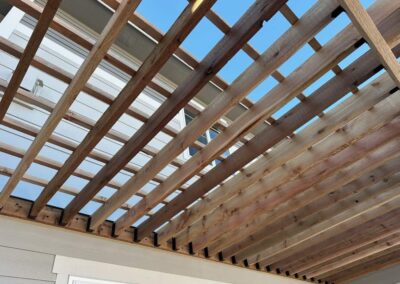 pergola build on back of light gray house in Aurora, Colorado